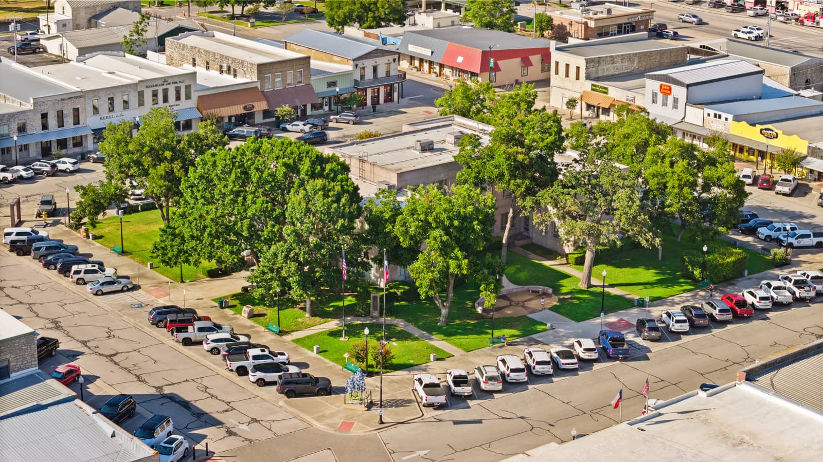 Burnet courthouse square surrounded by leafy trees and historic storefronts