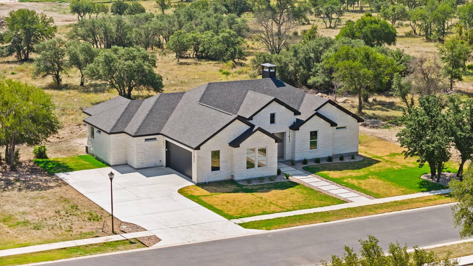 Angled aerial view of the front entry and garage at 258 Sunday Drive