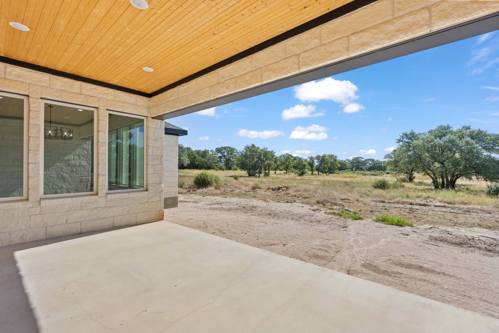 Wood ceiling and open views from the covered porch at 258 Sunday Drive