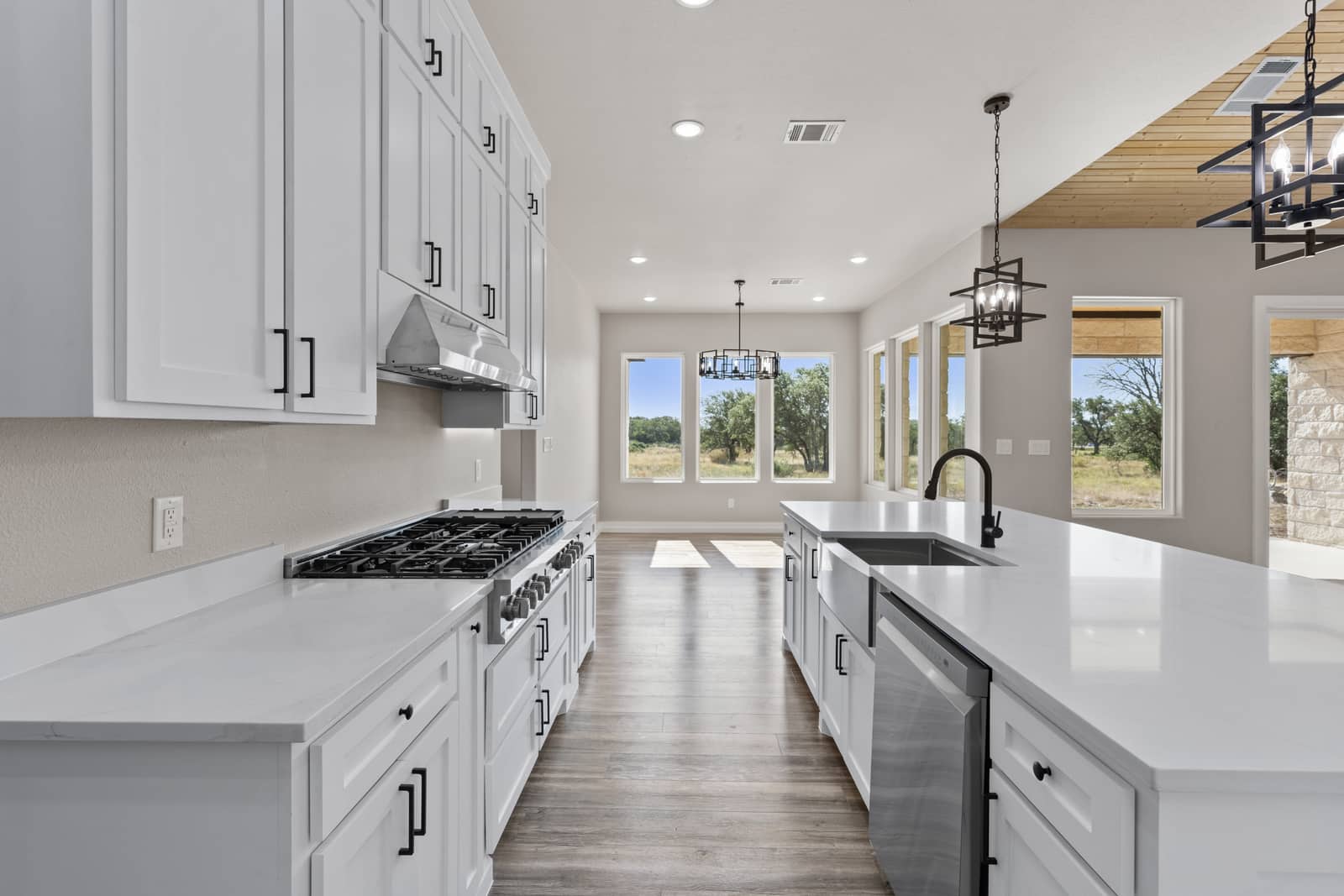 Kitchen worktop, island and dining lights at 258 Sunday Drive