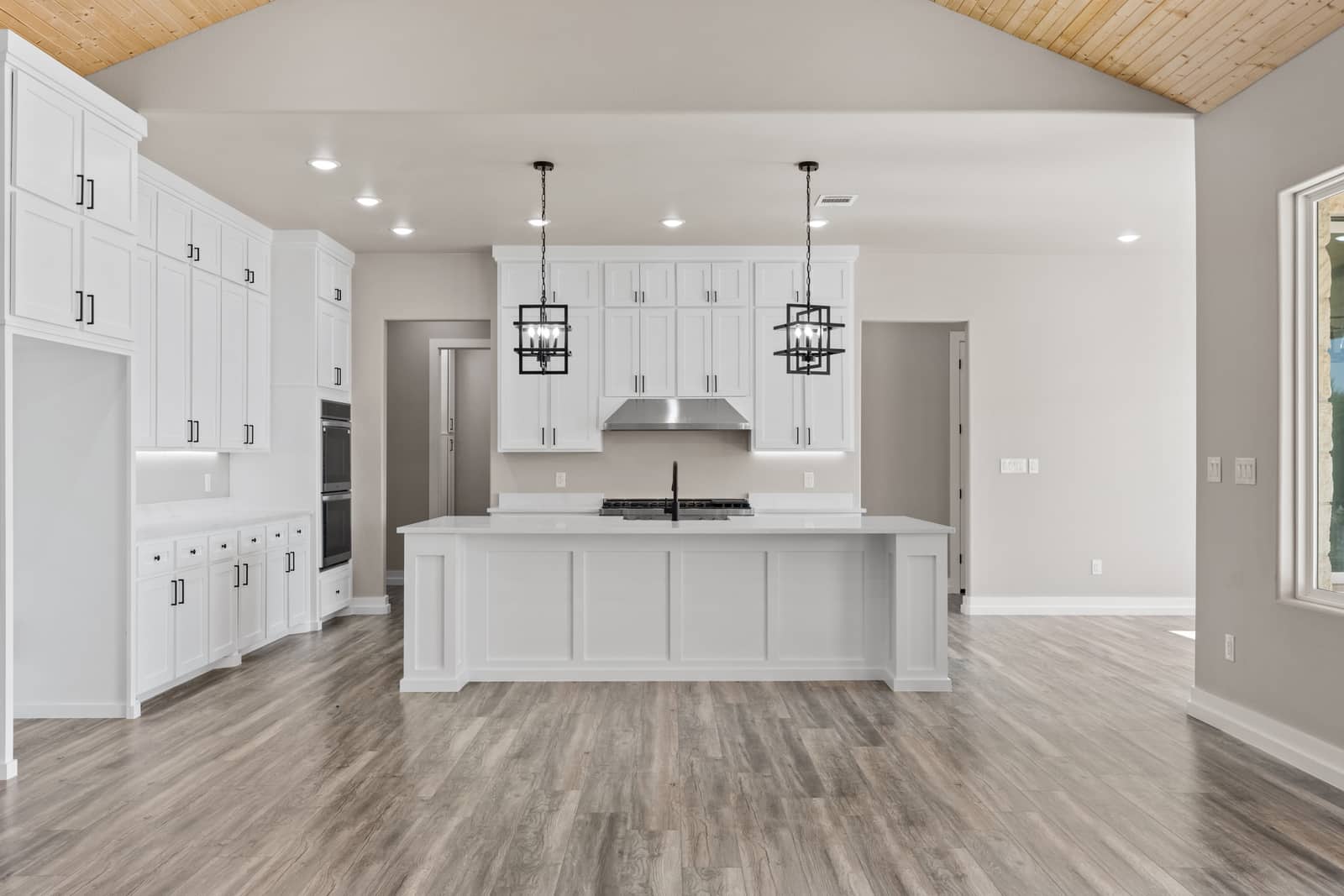 White kitchen and island at 258 Sunday Drive