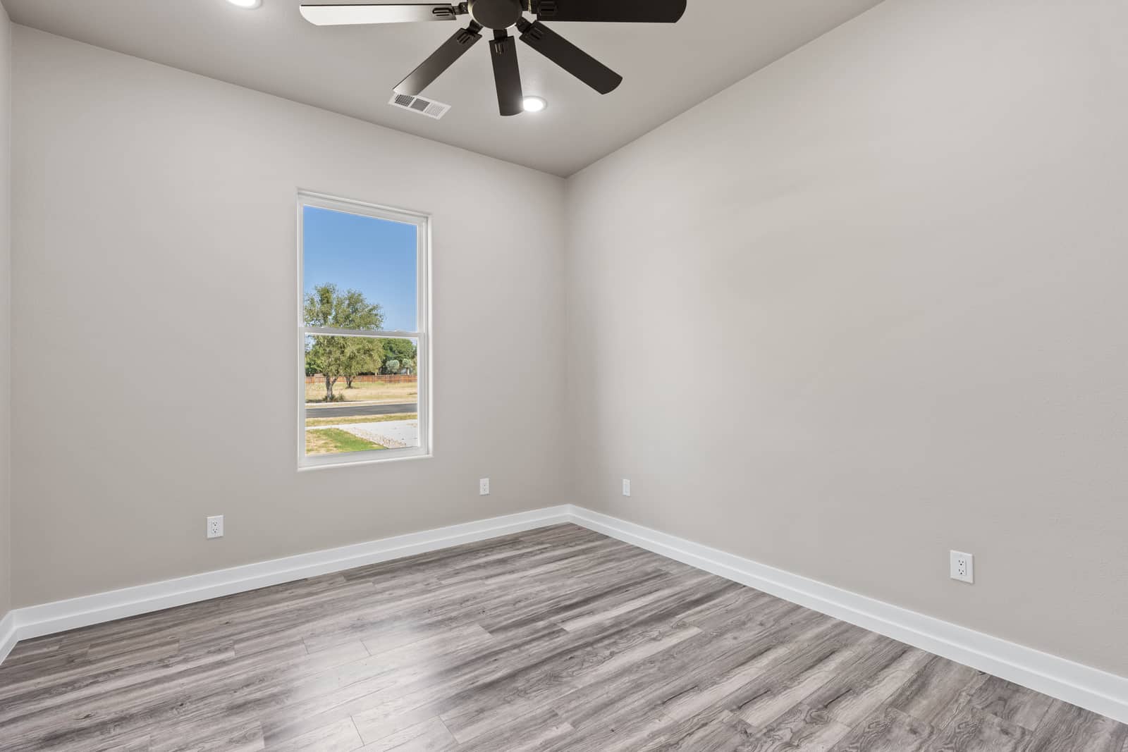 Secondary bedroom with a front-facing window at 258 Sunday Drive