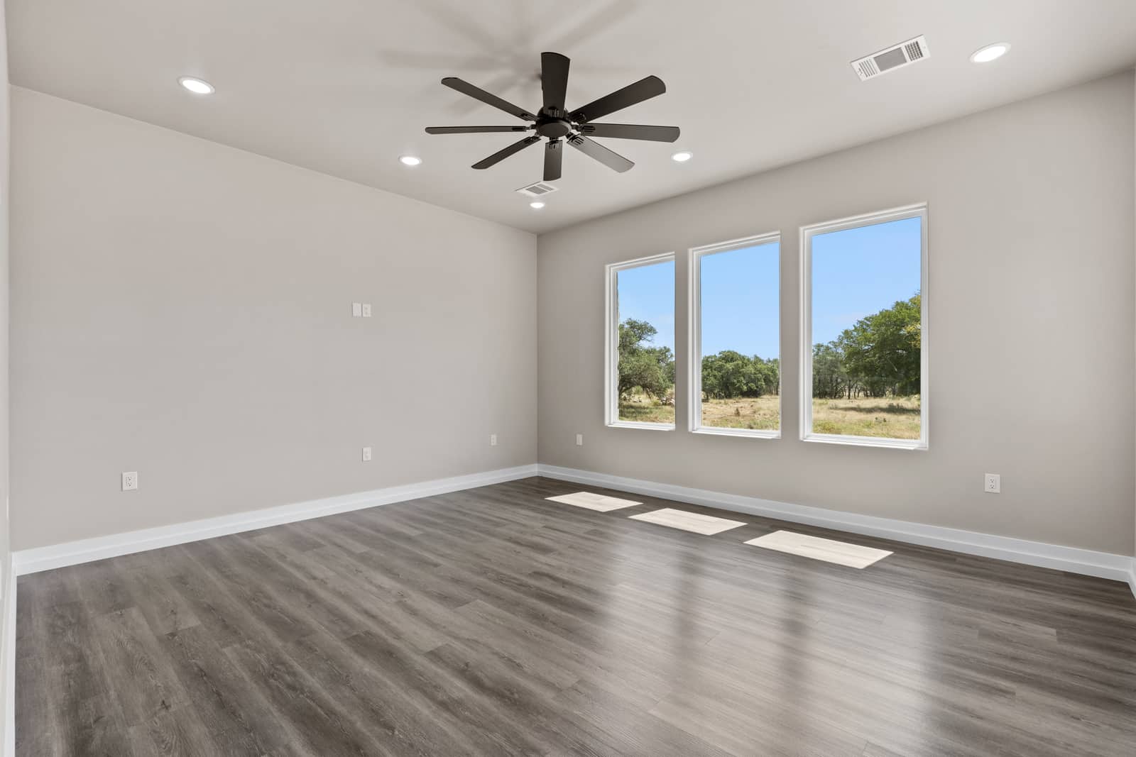 Bedroom with paired windows and a ceiling fan at 262 Sunday Drive