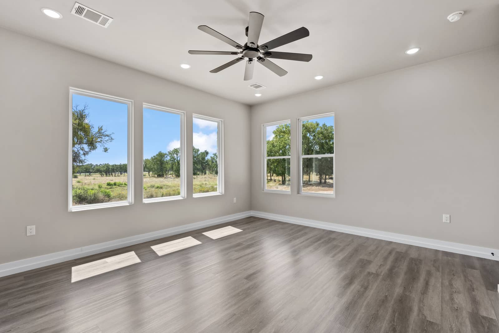 Sunlit bonus room with windows on two walls at 262 Sunday Drive