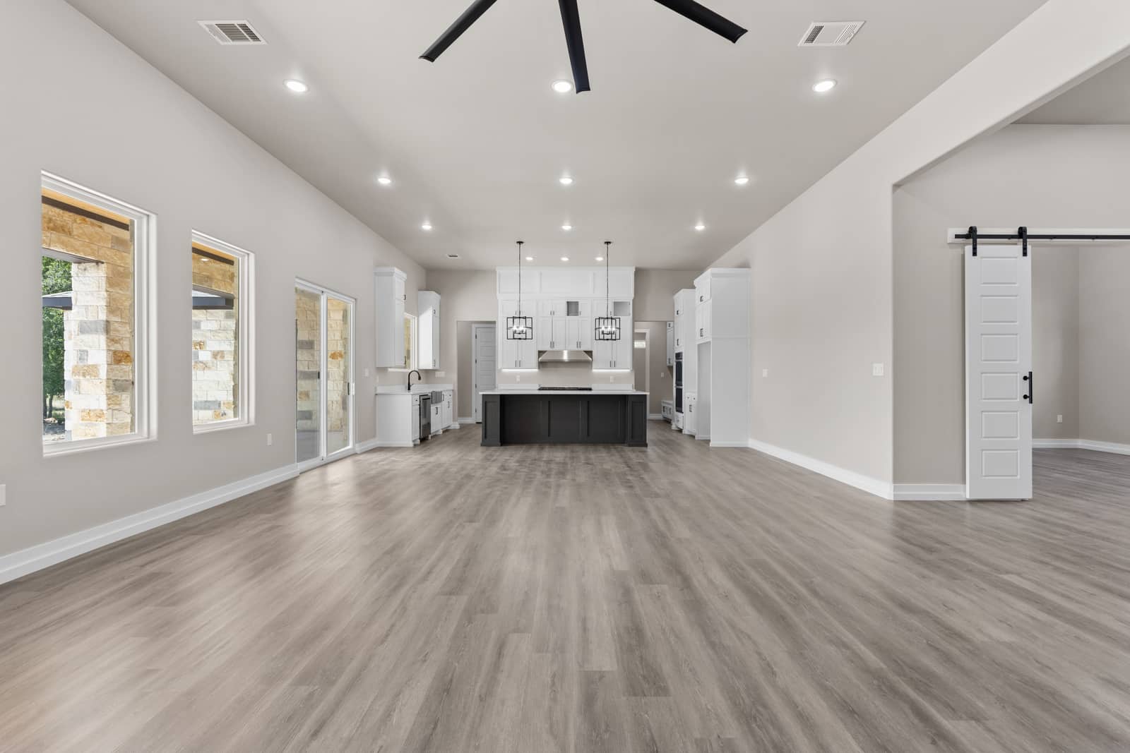 Long gathering room opening to the kitchen at 262 Sunday Drive