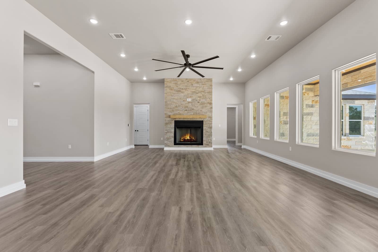 Long living room with a stone fireplace at 262 Sunday Drive
