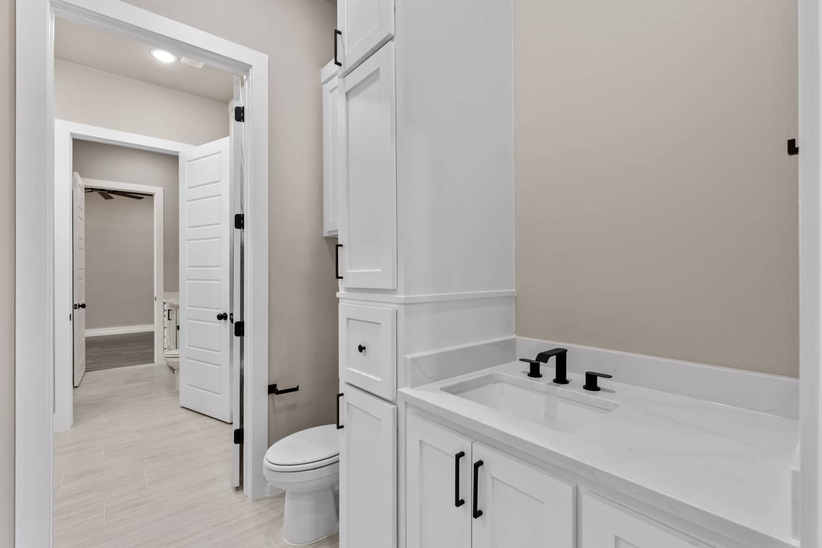 Bathroom with white cabinetry and a separate bathing area at 262 Sunday Drive