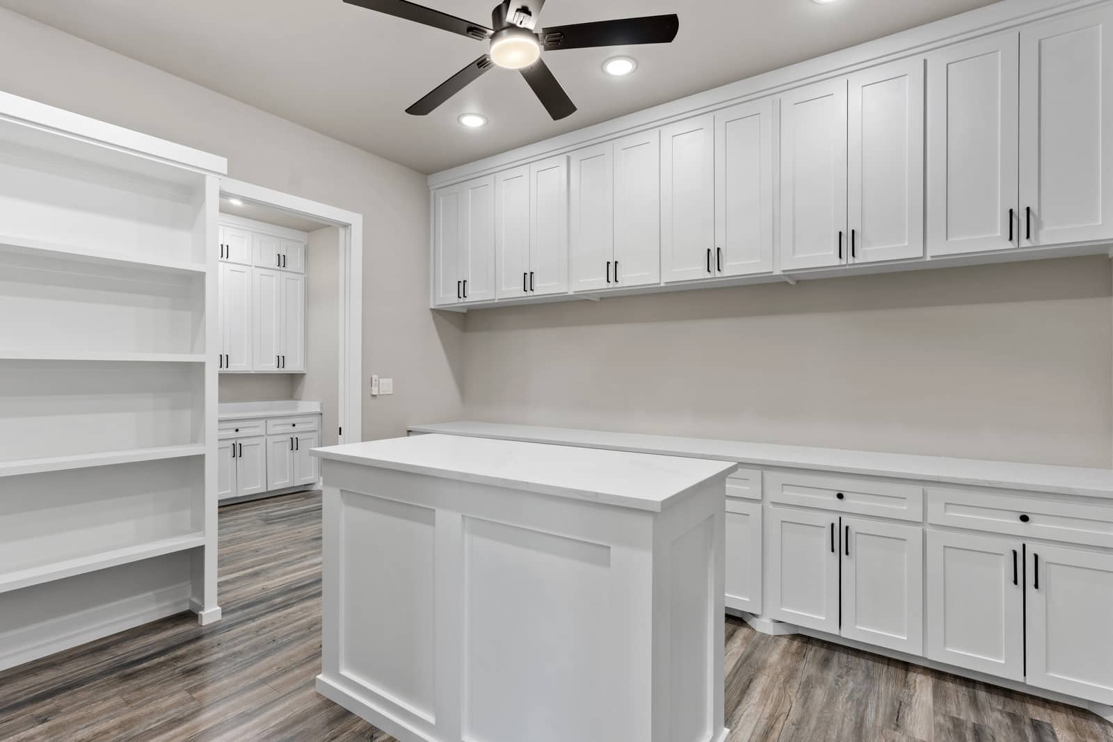 Walk-in closet with an island, drawers and hanging storage at 265 Sunday Drive