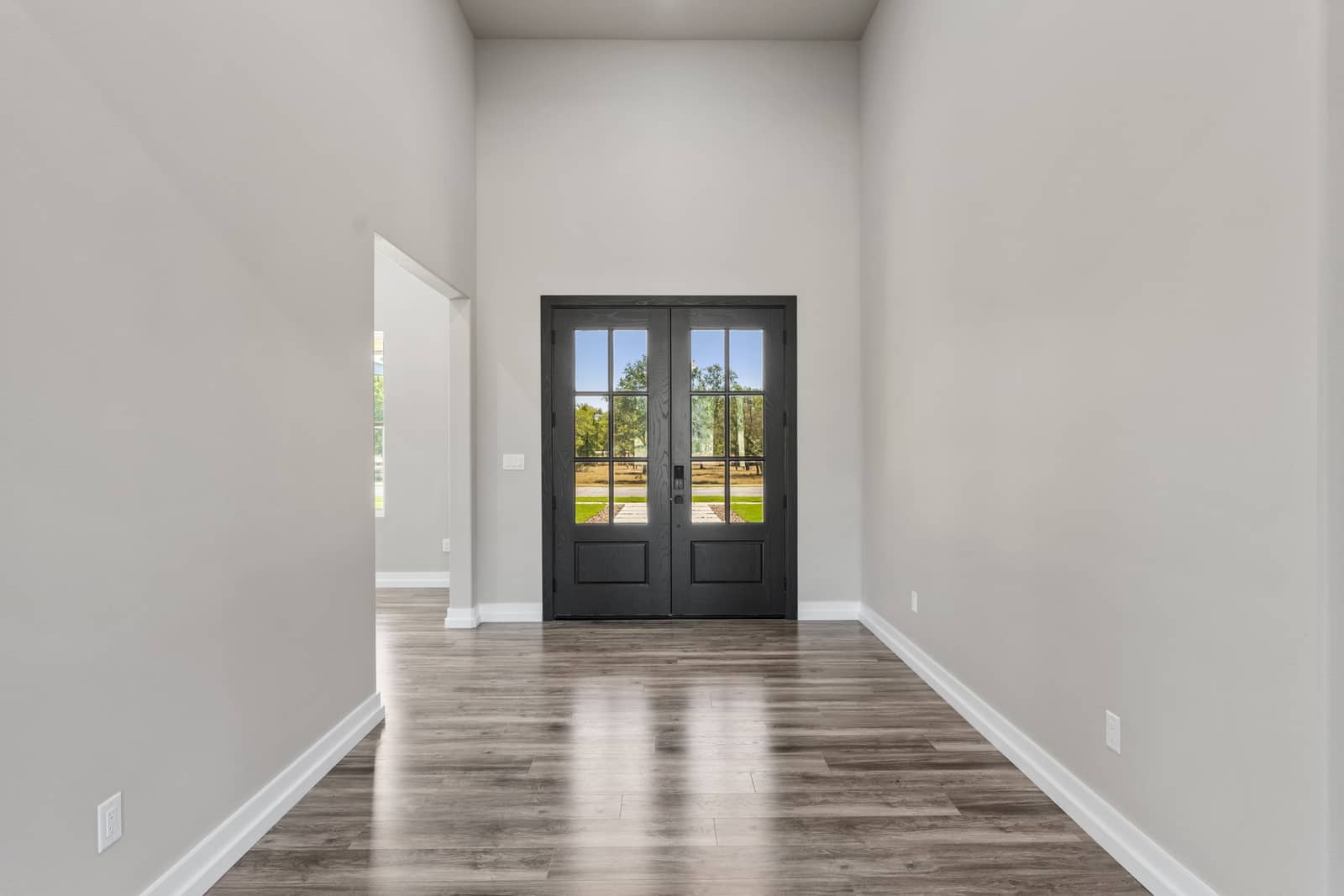 Entry hall with a black glazed front door at 265 Sunday Drive