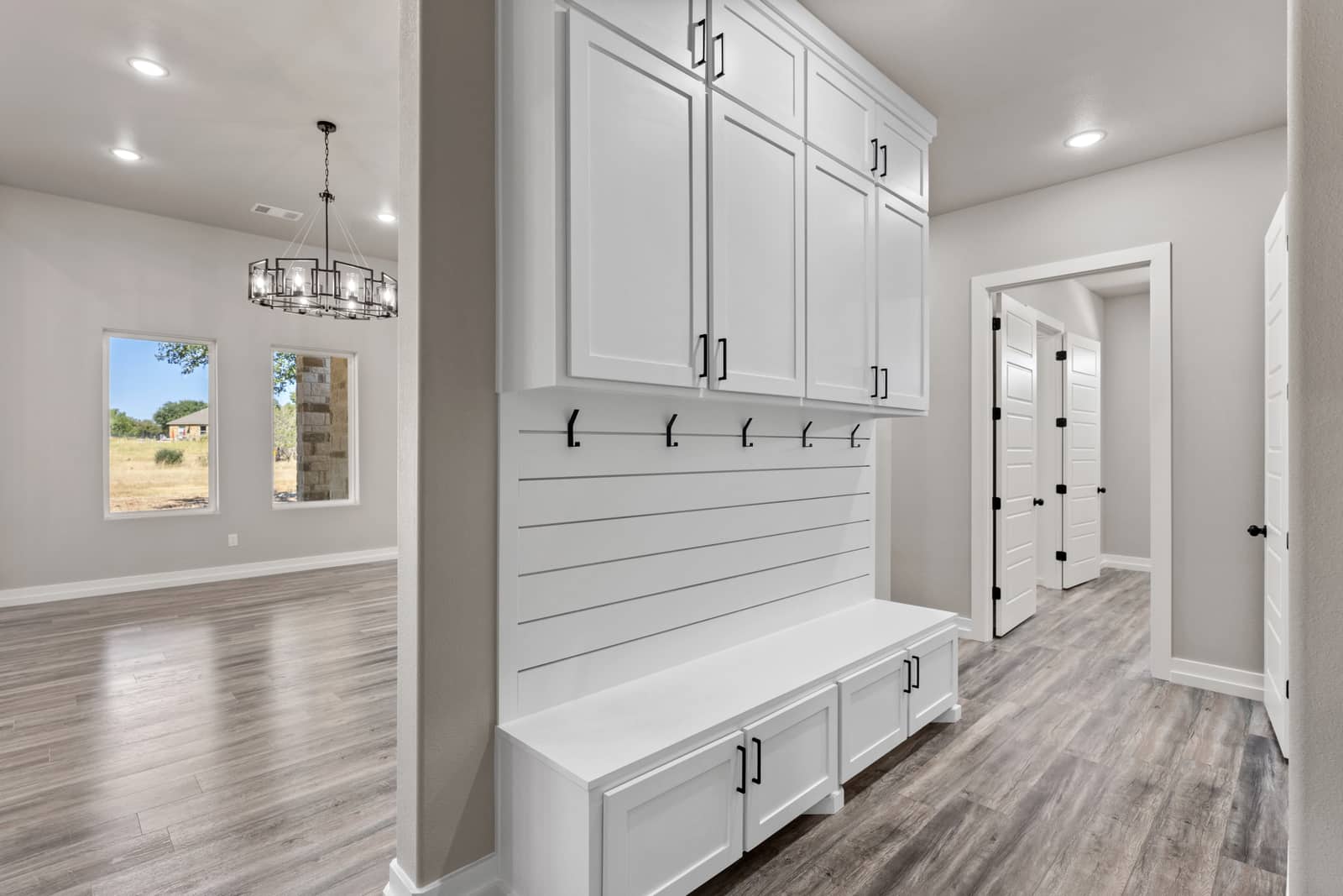 Built-in bench, hooks and storage cabinets at 265 Sunday Drive