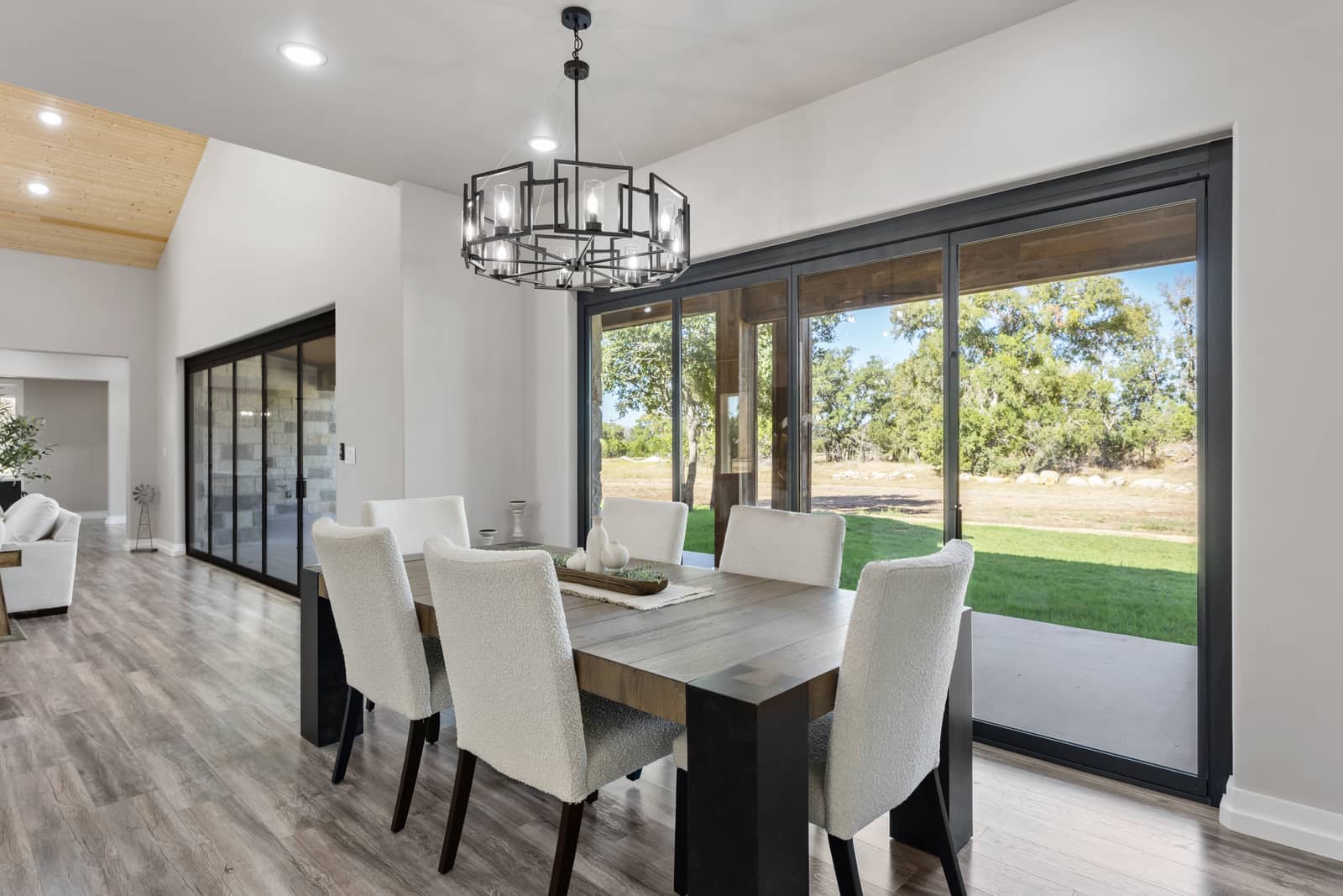 Furnished dining area beside wide sliding glass doors at 271 Sunday Drive
