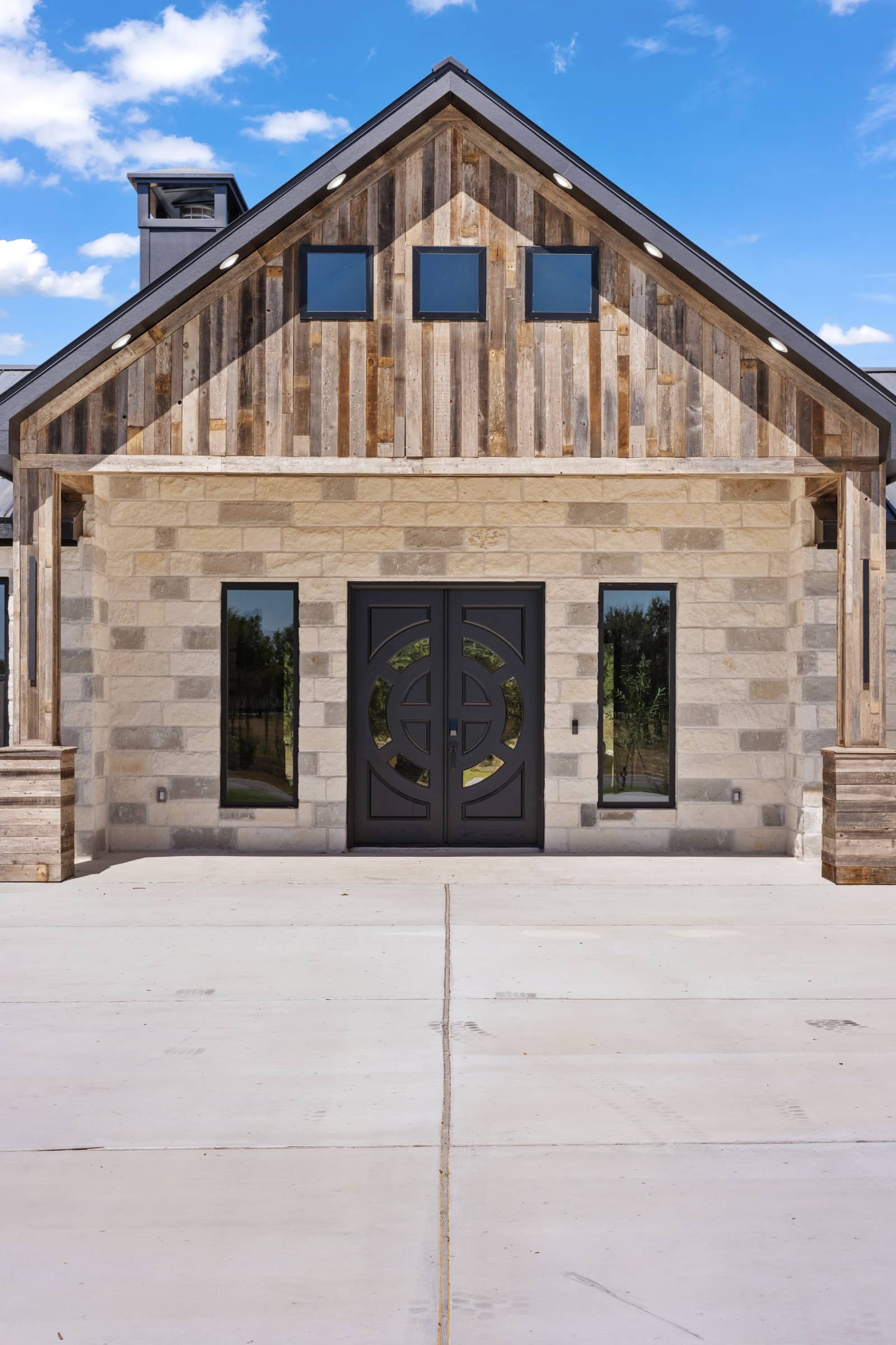 Reclaimed wood gable and limestone entry at 271 Sunday Drive