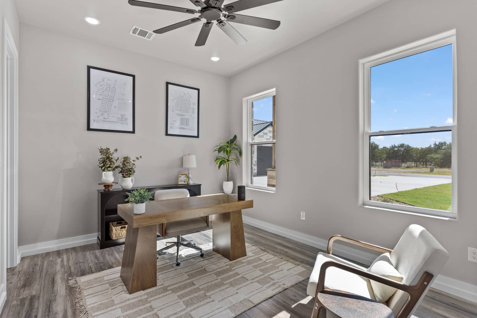 Furnished home office with a wood desk and accent chair at 271 Sunday Drive