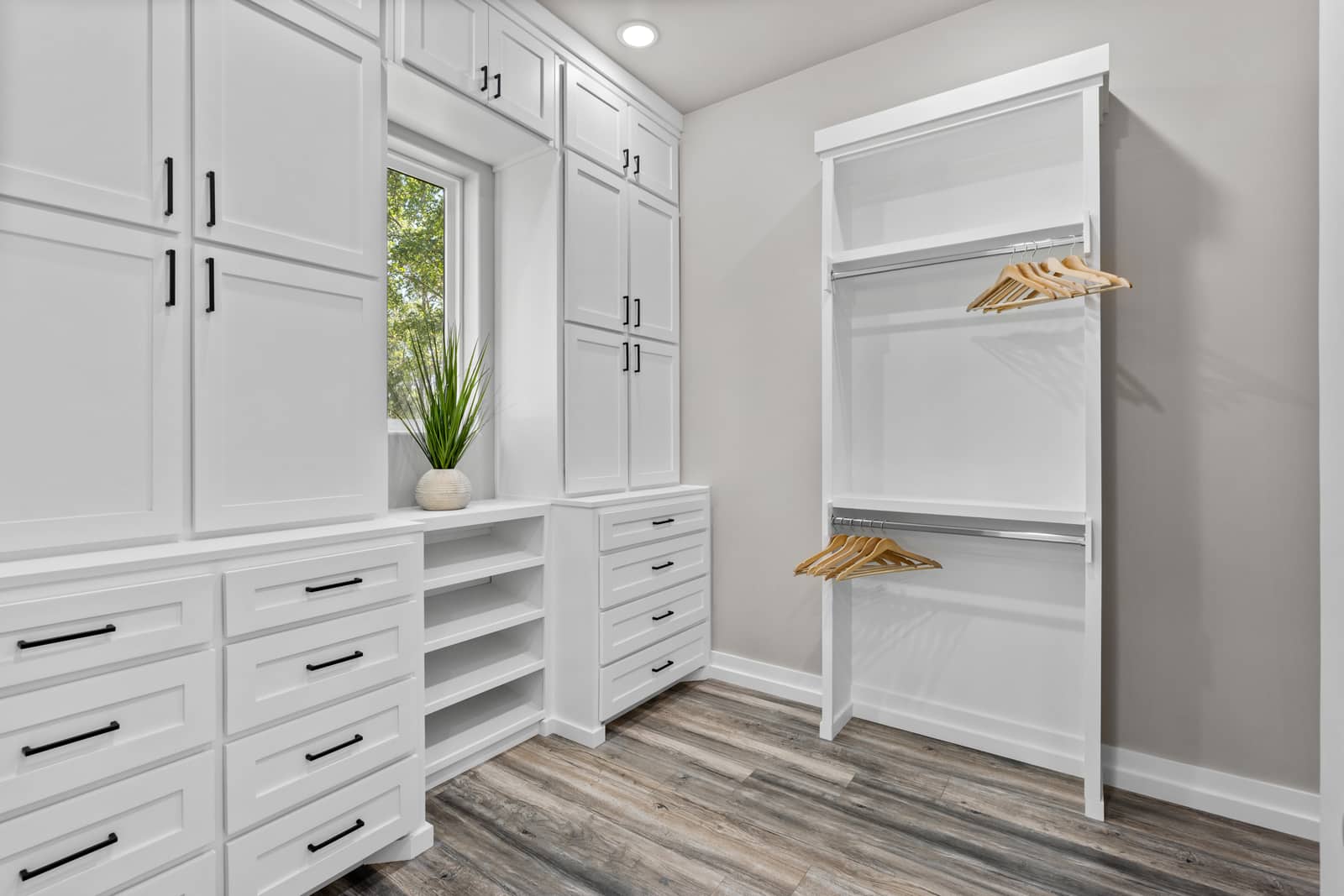 Walk-in closet with built-in drawers and hanging storage at 271 Sunday Drive
