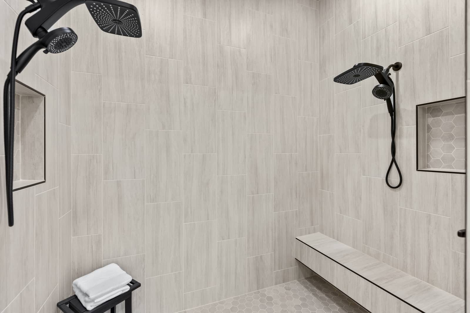 Light tiled double shower with matte black fixtures at 271 Sunday Drive